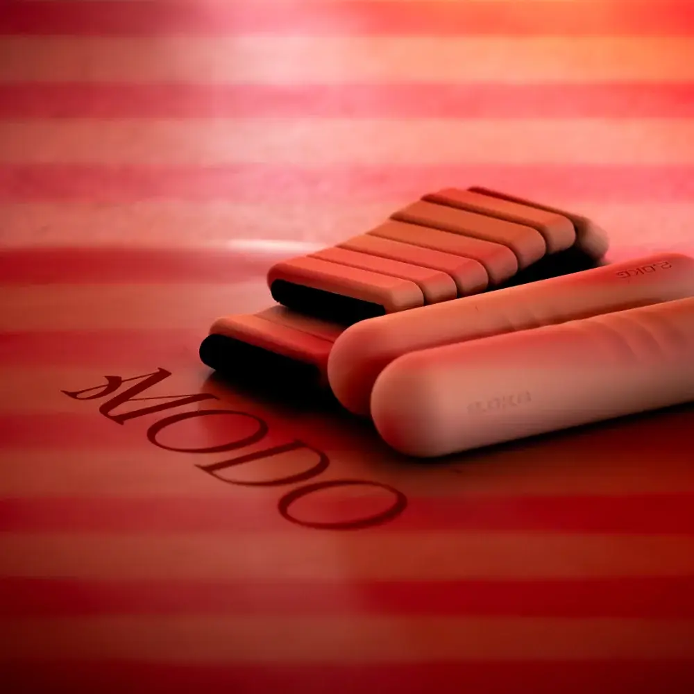 Pilates equipment in the Court De Padel fitness studio with red lighting